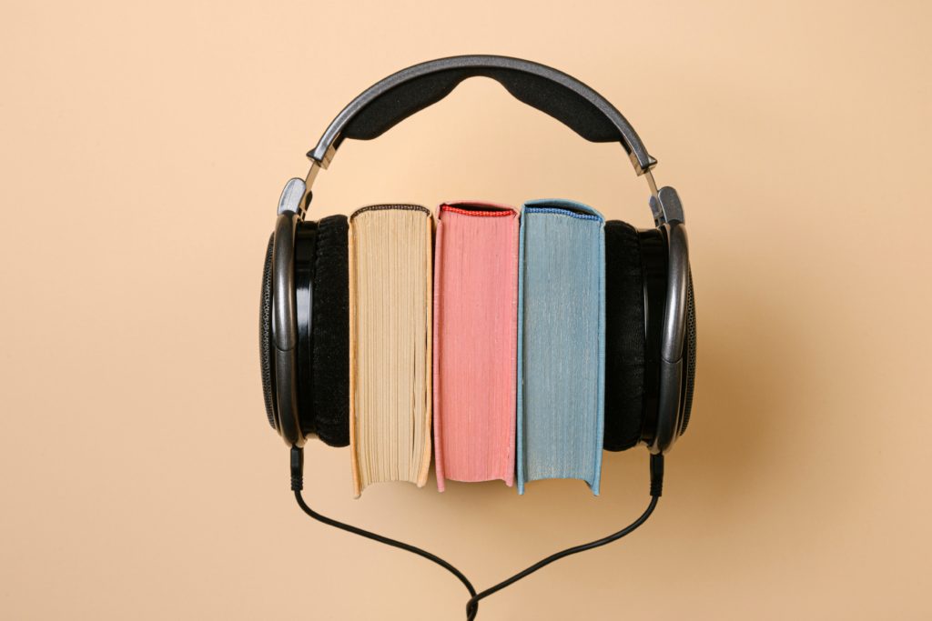 photo of books with headphone-read books or to listen-online super tutors